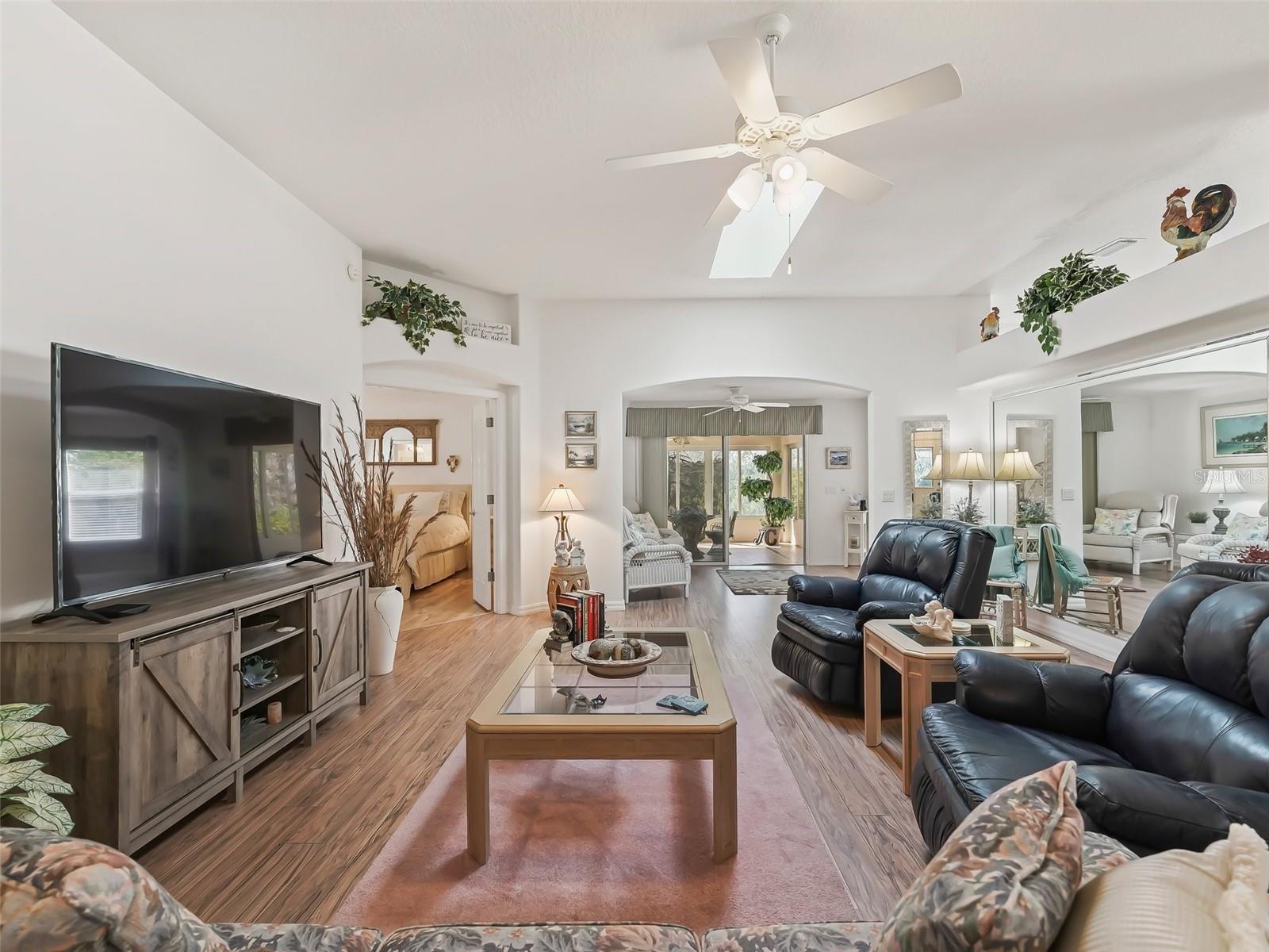 Livingroom showcasing the arch to the bonus room