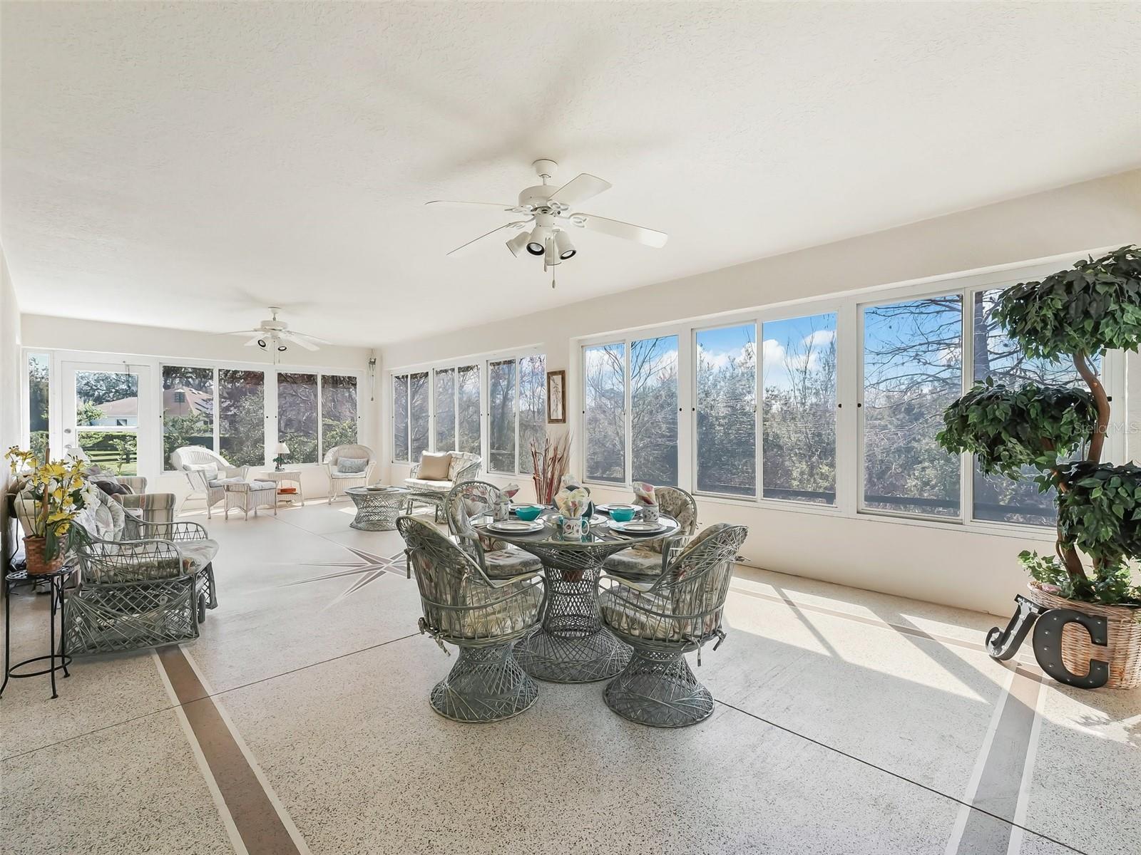 Enclosed Florida room - Lanai with epoxy floor and Atlantic star detail on floor, GREAT ENTERTAINING SPACE backed up to Wildlife Preserve