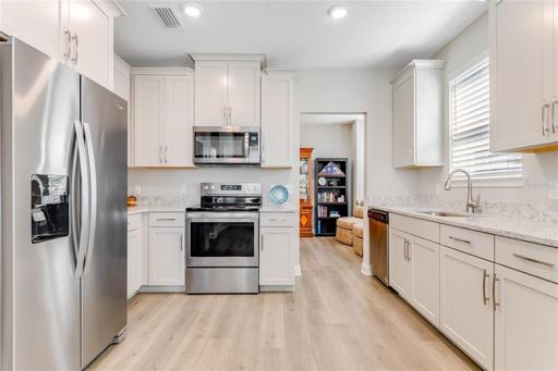 Beautifully appointed kitchen with 42" cabinets with crown molding, Quartz Counters, SS appliances