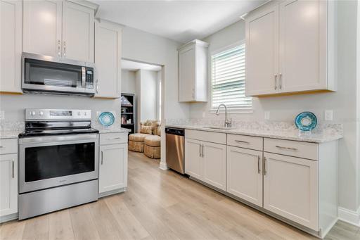 Beautifully appointed kitchen with 42" cabinets with crown molding, Quartz Counters, SS appliances