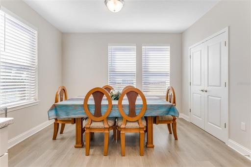 Dining area off Kitchen with double door pantry and windows allowing great light!