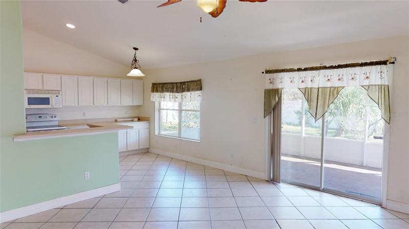SLIDING GLASS DOORS LEADING...
