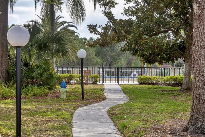 Path to community pool right down the street .