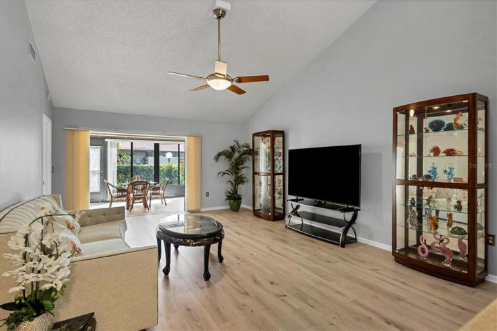 Great room, Vaulted ceiling wood laminate floor