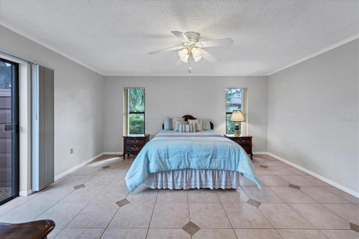 Master bedroom tile floor, patio view, walk in closet