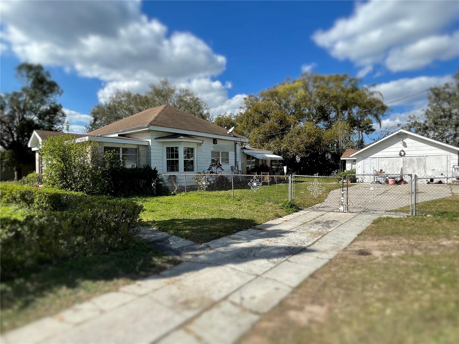 Main home, garage with attached one bedroom apartment.