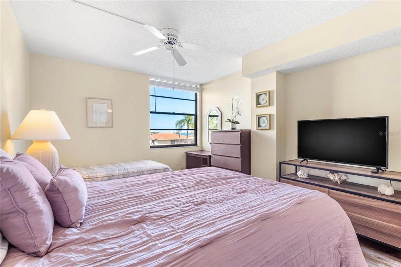 Second bedroom is spacious and also has partial water views.