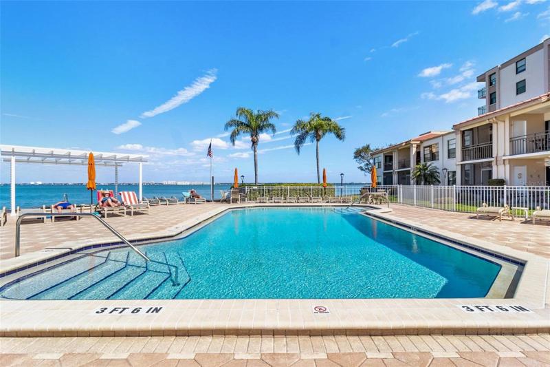 Community Pool is a tropical paradise with wide open views of Boca Ciega Bay
