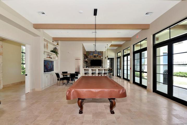 Pool table, wet bar and tvs