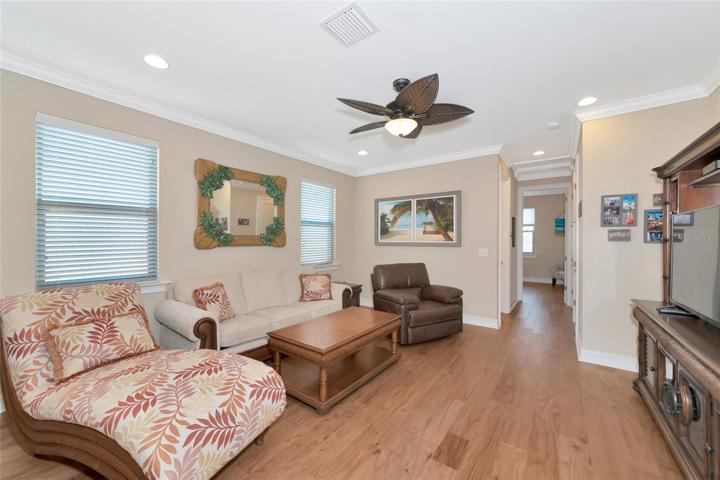 Second floor loft area with wood floors