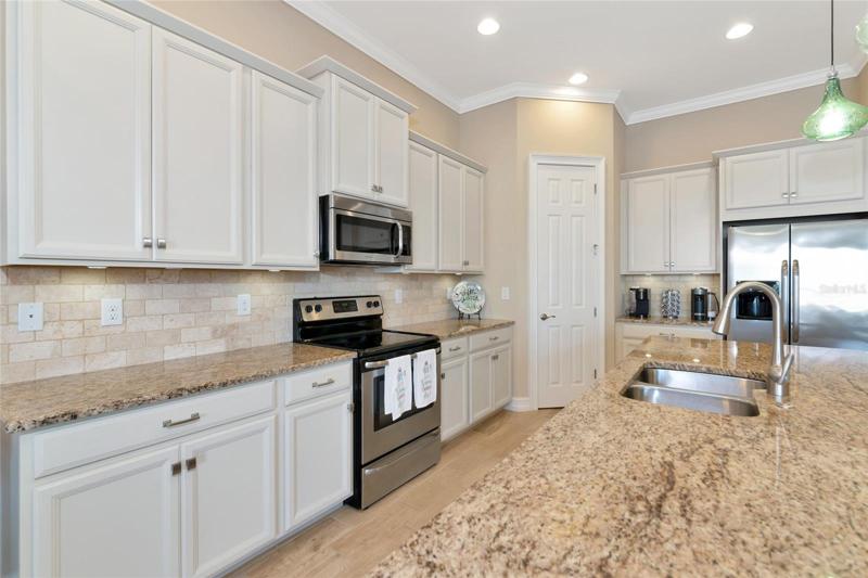 Kitchen corner pantry with custom built-in shelving