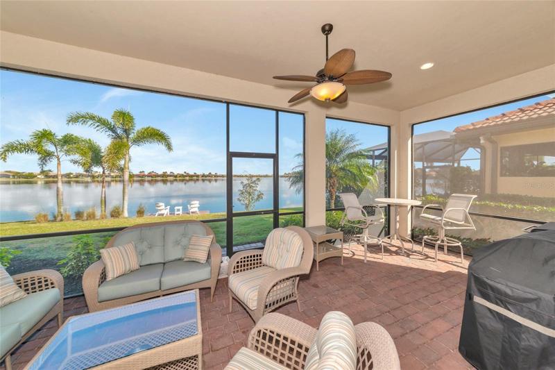 Nice sized, brick pavered lanai with gorgeous lake view