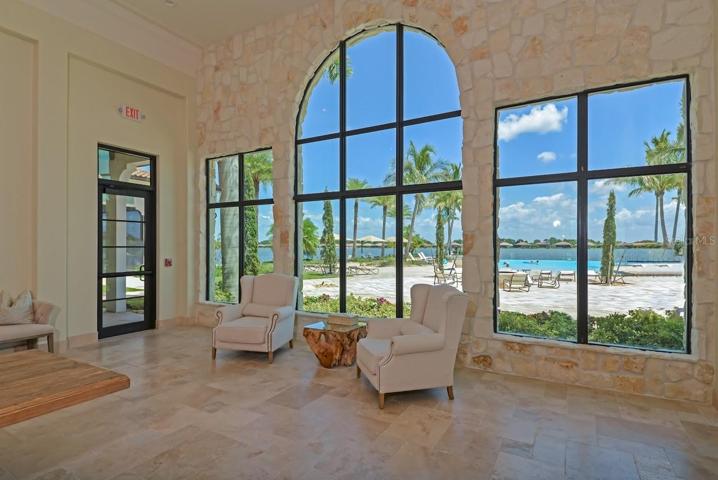 Clubhouse sitting area with view of pool
