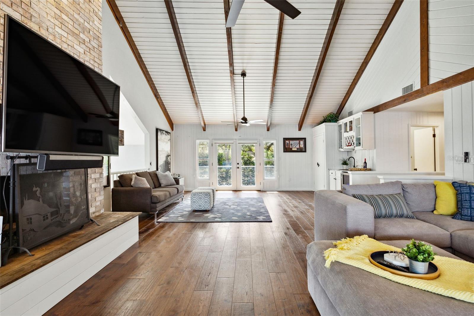 Bonus Room with beamed cathedral ceilings and second of two fireplaces