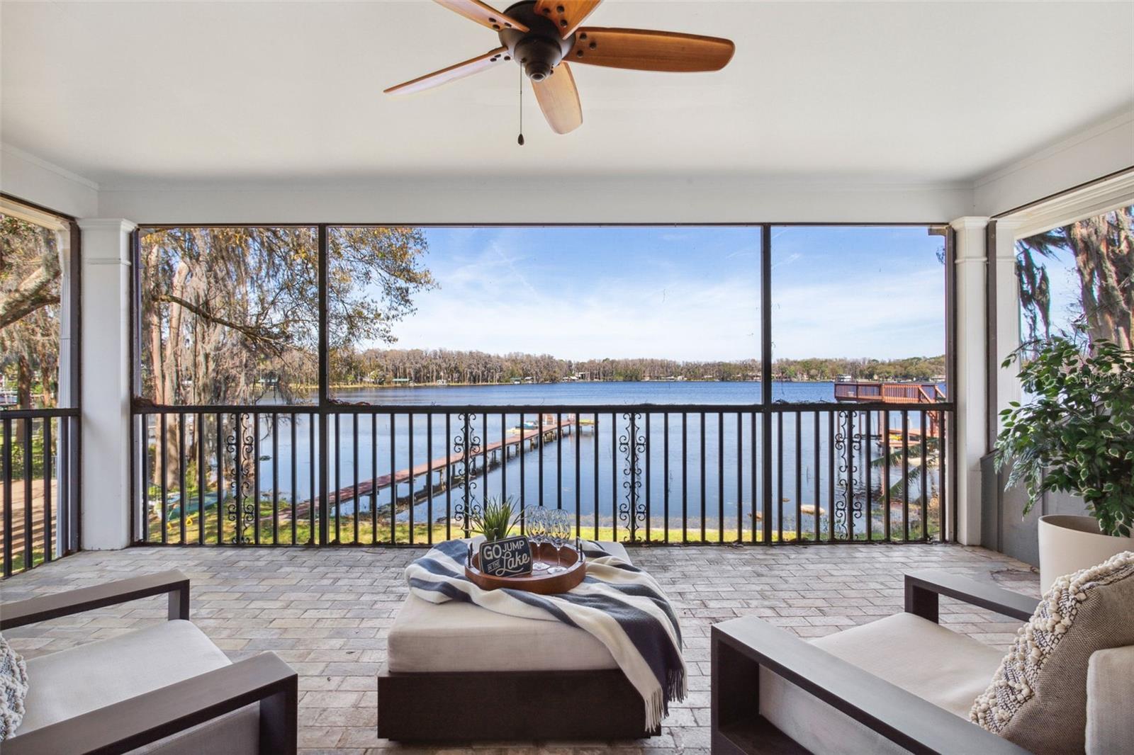Full-screened porch off of Bonus Room with view of lake