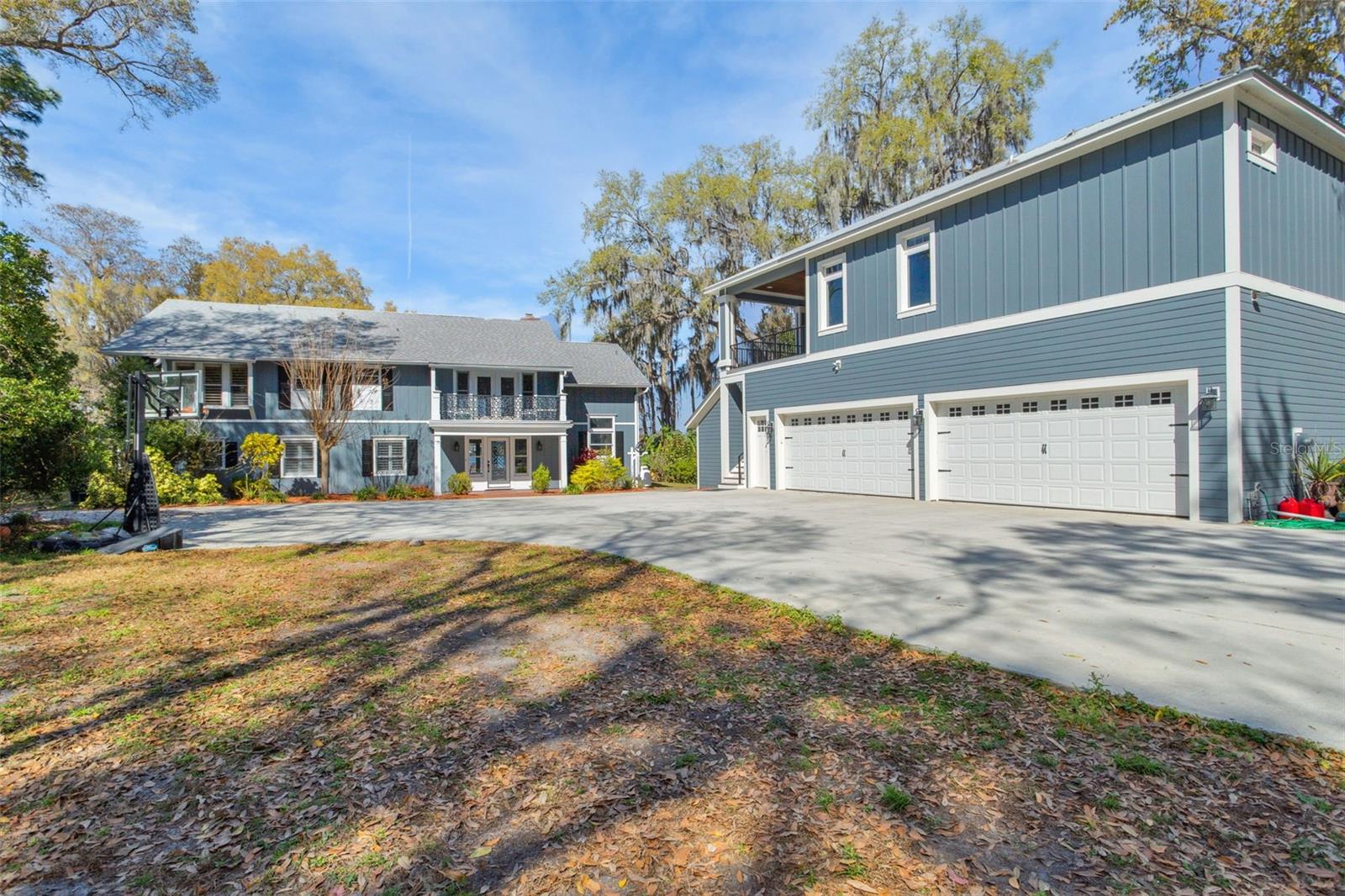 View of main house and 4-car garage with apartment