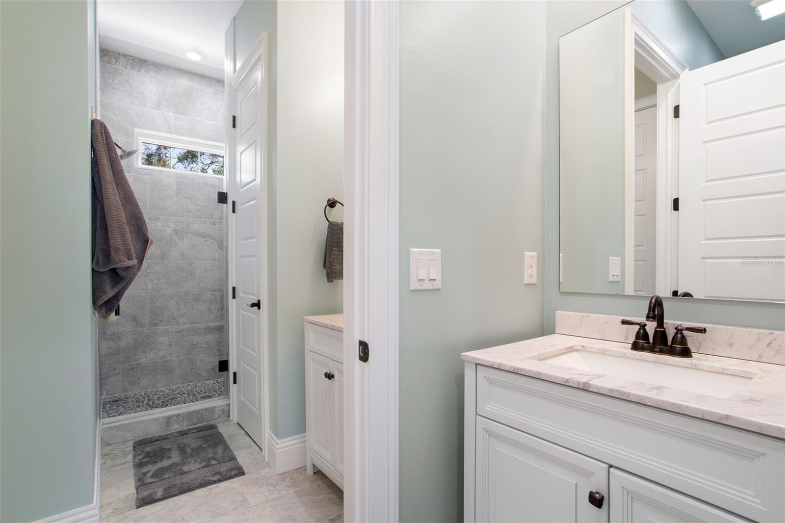 Apartment bath with shower and separate vanities