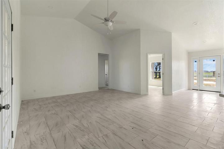 Living room facing main entrance and den