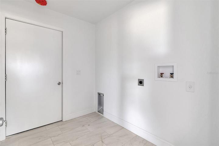 Master bath view to walk-in closet - water closet