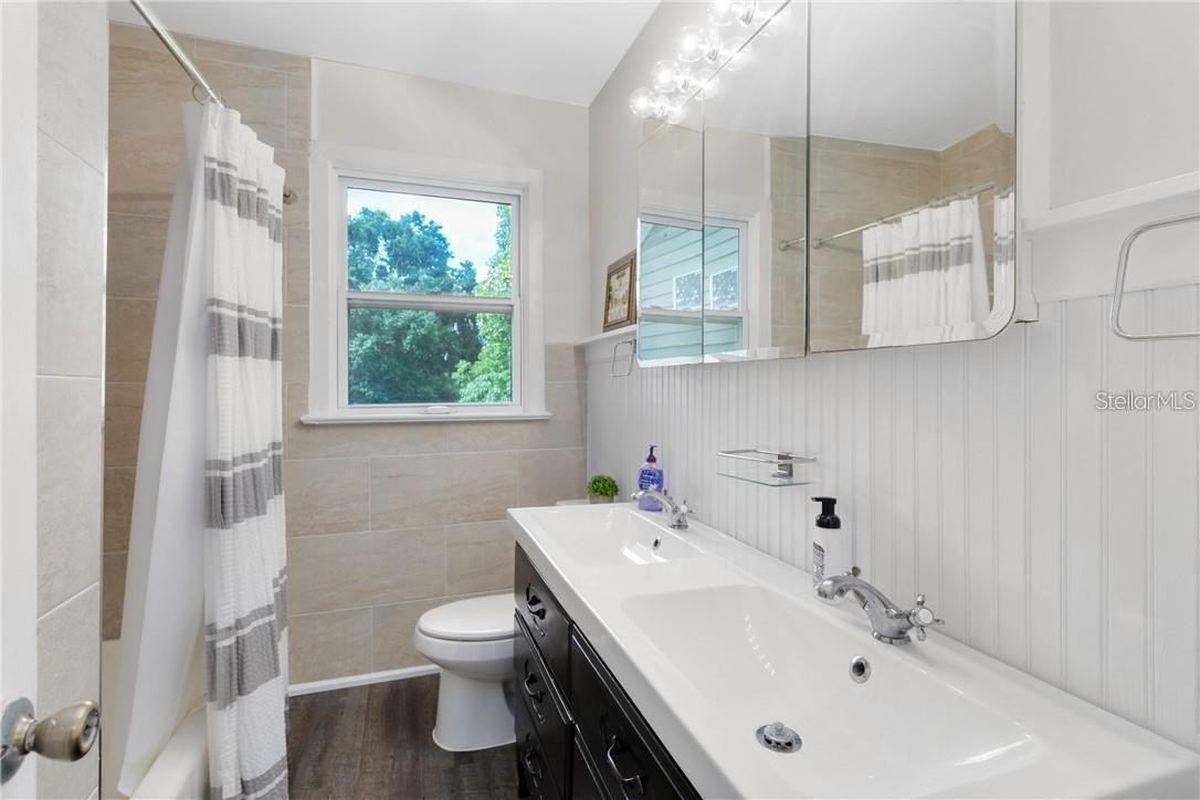 Master Bedroom opens to dressing room and upstairs laundry with en suite bathroom.