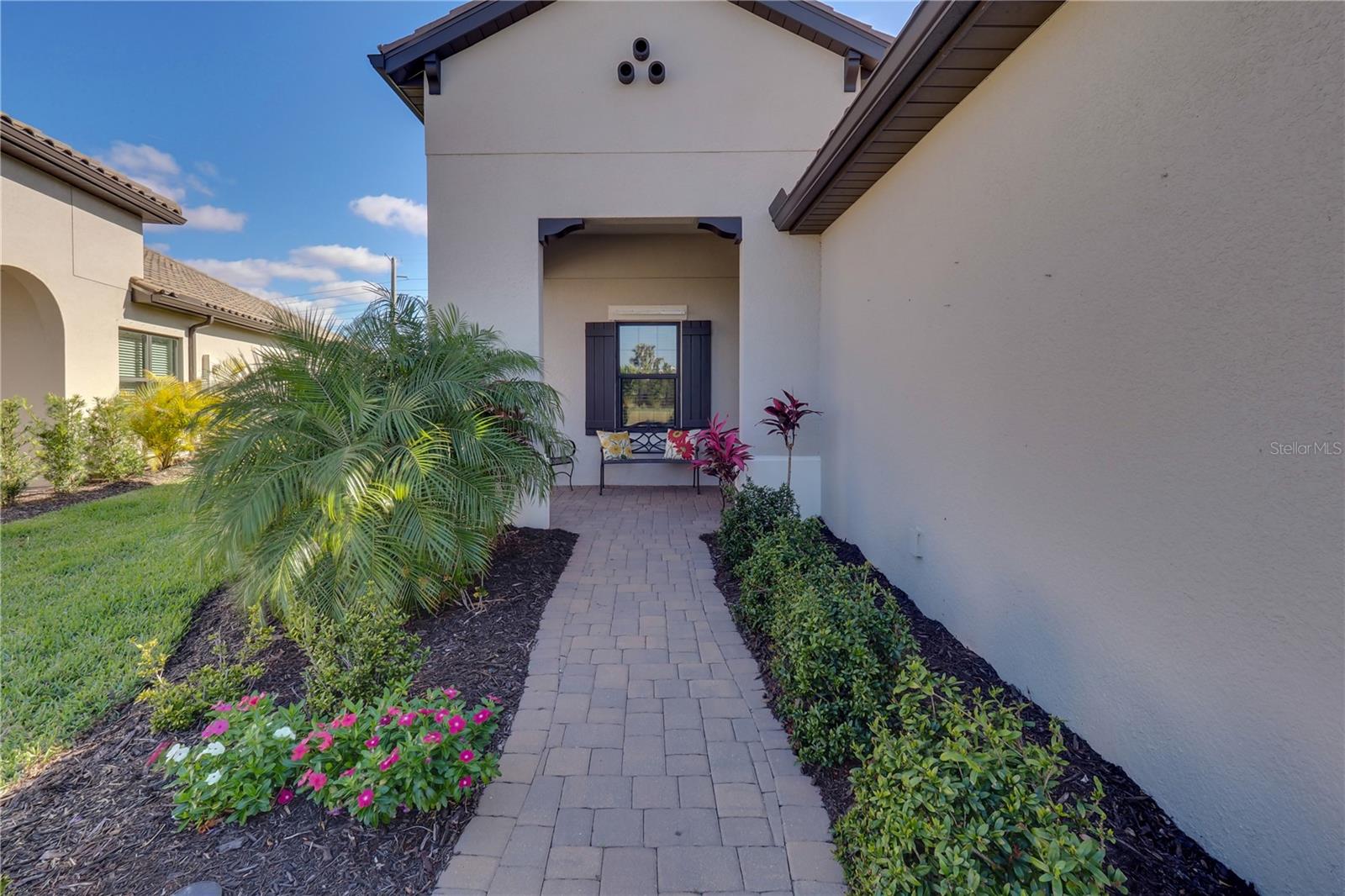 Landscaped Paver Walk Way to Covered Porch and Entrance