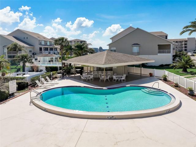 View from front porch. Clubhouse just beyond the carport, where your spot is located (#922). Pool and tennis courts are short strolls away, too!