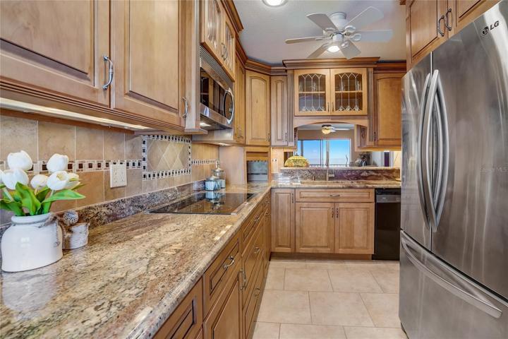 Small drop down table under window. Laundry, water heater and air handler in closet past the refrigerator.