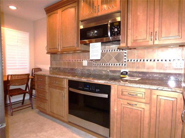Kitchen has a window on east side, with plantation shutters
