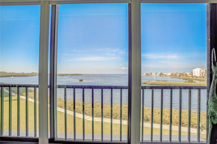 Lanai is screened and has a triple slider that is hurricane glass and there are pull down hurricane shutters as well.
