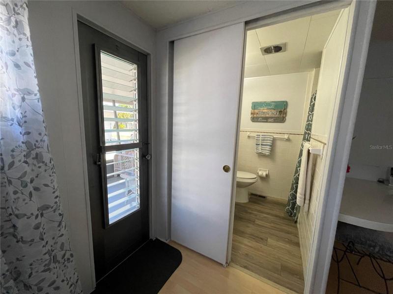 Second exit, to the screened room.