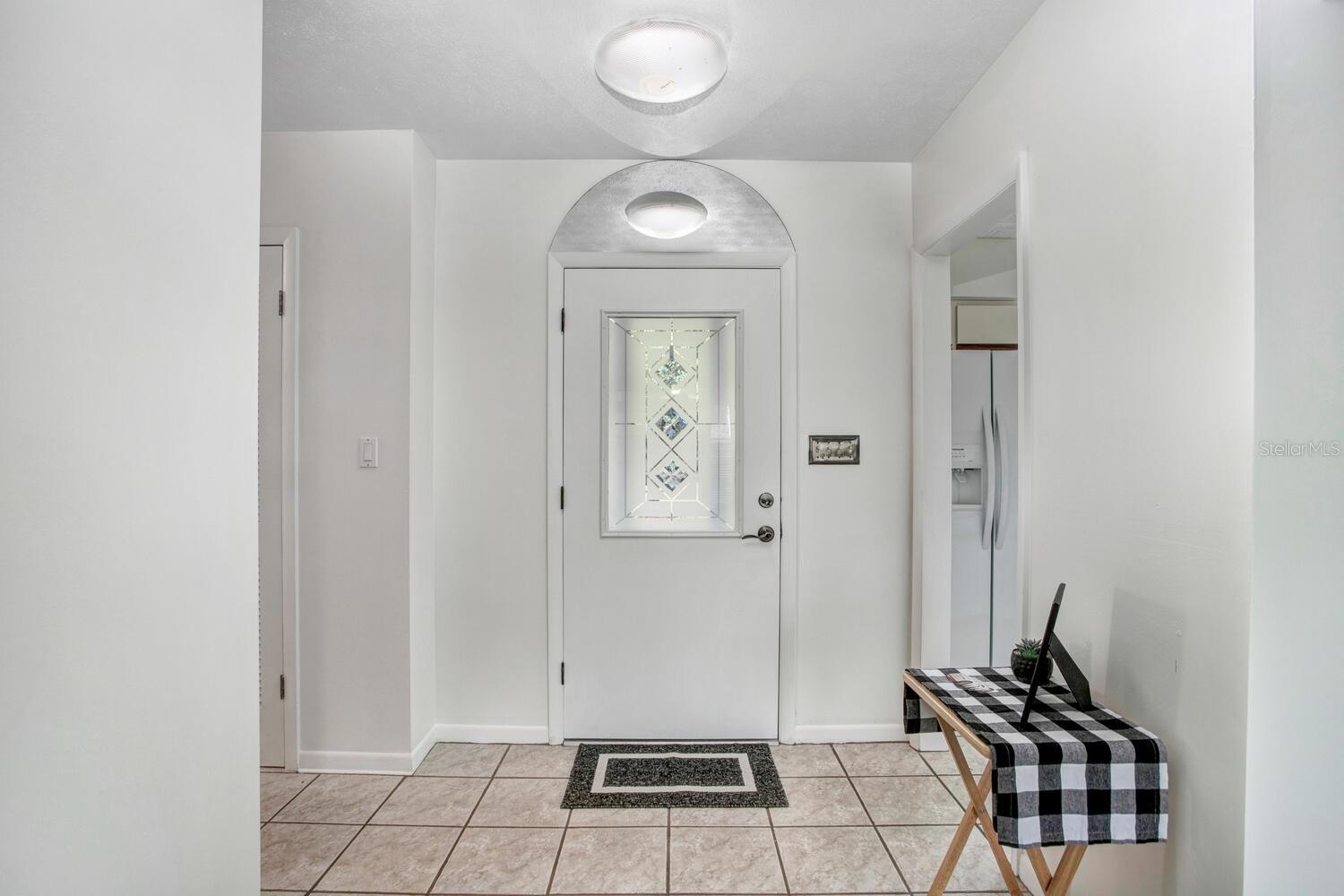The foyer of the home is very welcoming, and there's a SKY TUBE overhead to allow natural sunlight or moonlight to shine in.