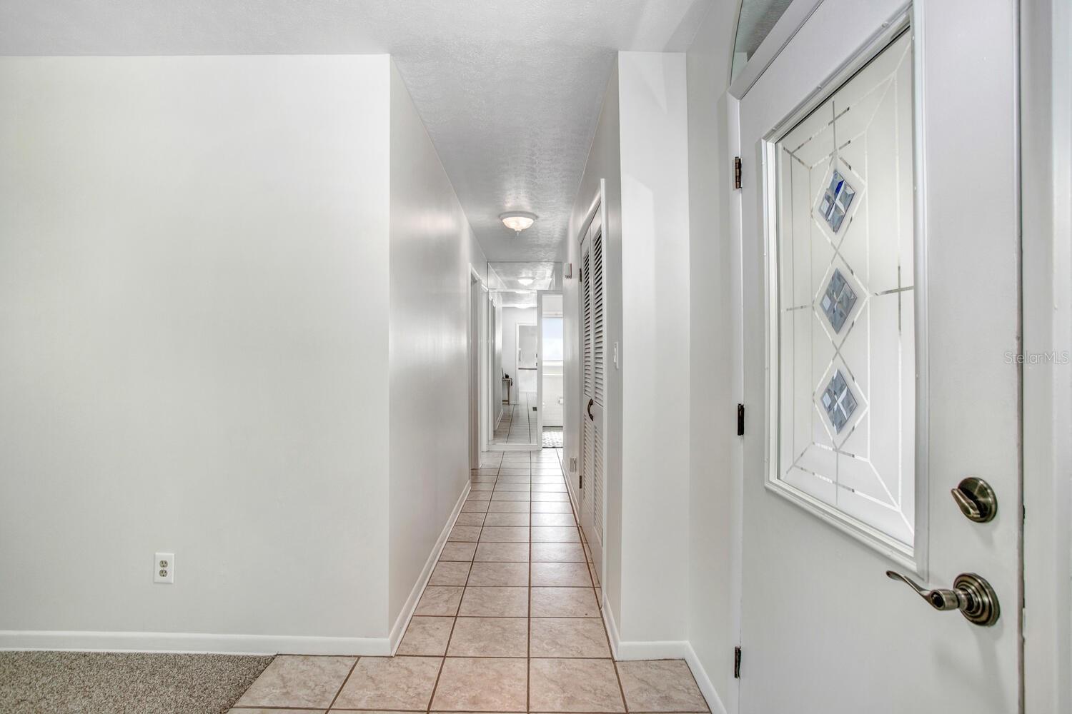 Just inside and to the right is a hallway to the bedrooms and bathrooms...and a very large hallway closet.