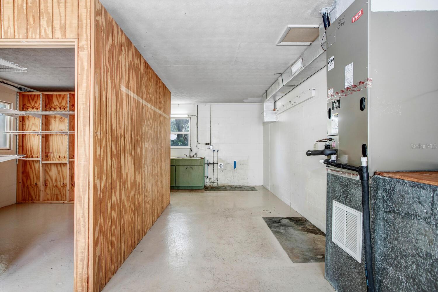 The AC handler is easily accessible, and there's lots of wall space for hanging tools or storage shelves.