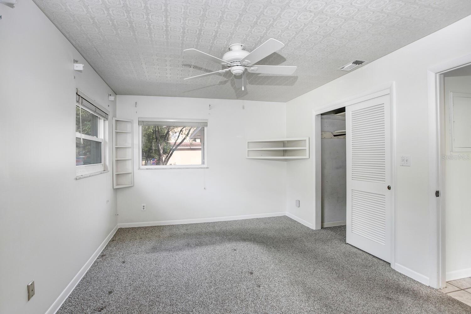 Master bedroom has a ceiling fan and THREE double-paned windows!