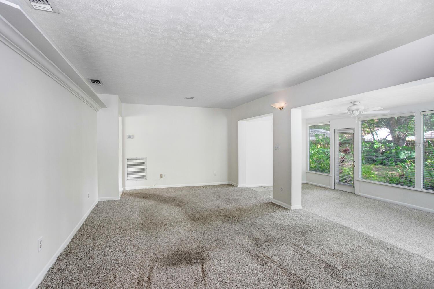The carpet is very easily replaceable, and the listing price already reflects the flooring needing to be changed.