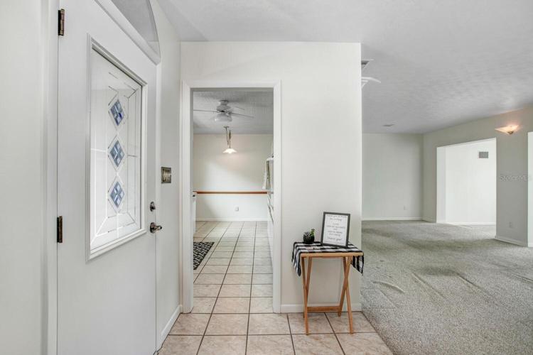 Just inside and to the left is the kitchen.