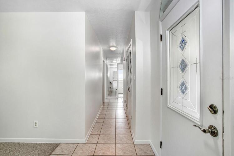Just inside and to the right is a hallway to the bedrooms and bathrooms...and a very large hallway closet.