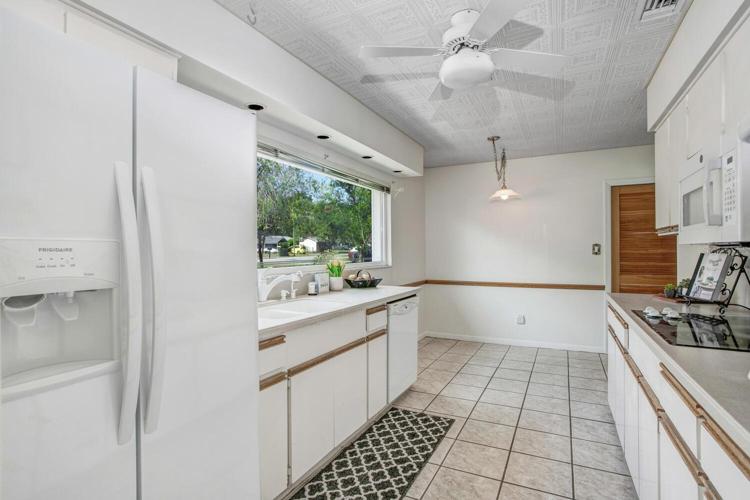 The kitchen appliances are newer, and there's a lot of lighting!