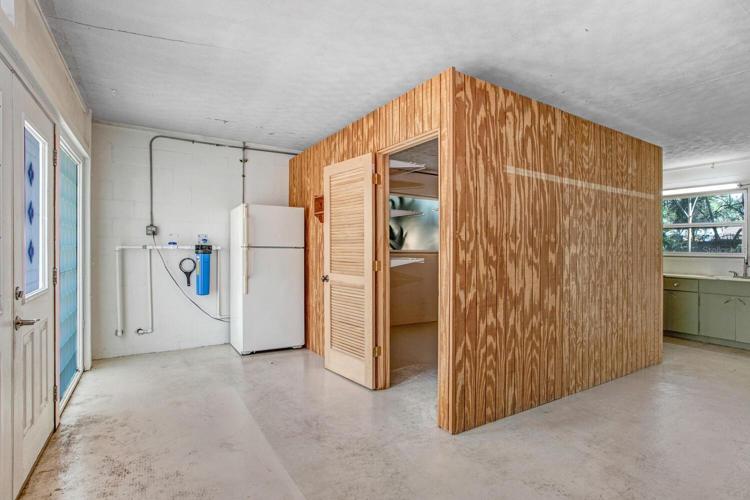 The converted garage is so functional! The wooden enclosed room can be used for all sorts of things!