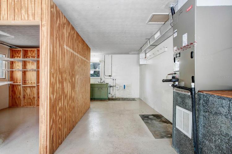 The AC handler is easily accessible, and there's lots of wall space for hanging tools or storage shelves.