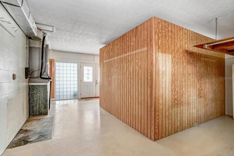 This can be easily converted back to a 2-car garage if a buyer desires.  Or the driveway is long enough for several cars, this space can be a 500 sqft extension of the home.