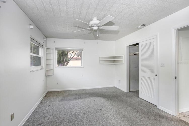 Master bedroom has a ceiling fan and THREE double-paned windows!