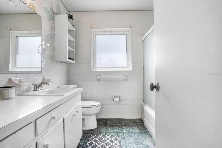 Hall bathroom has tub/shower combo.