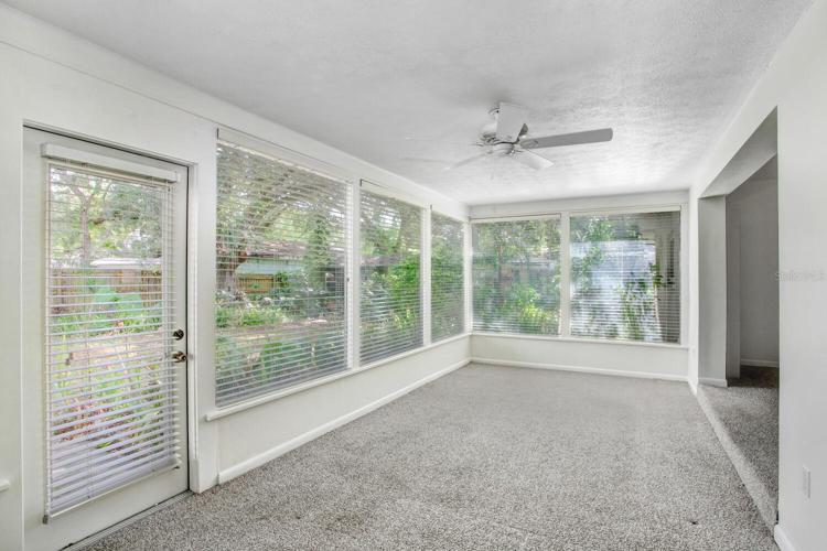 The Florida room looks out to the large, beautiful, very private, peaceful backyard!