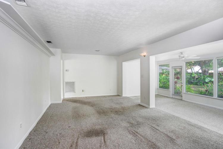 The carpet is very easily replaceable, and the listing price already reflects the flooring needing to be changed.