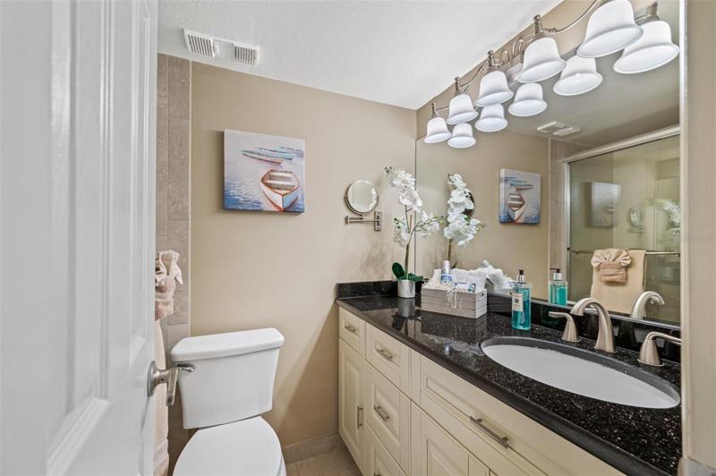 Master Bathroom with custom vanity and granite vanity top. Extended vanity gives plenty of bathroom storage space.