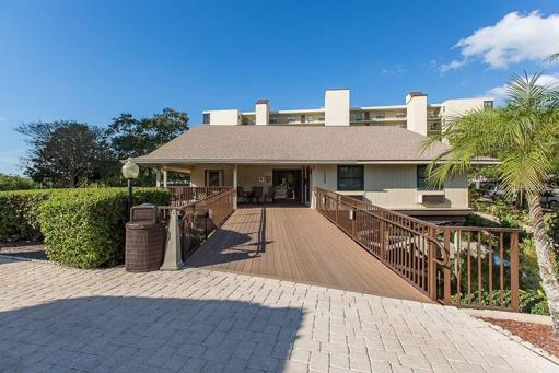 Village IV clubhouse with outdoor lounge. Clubhouse is great for family social gatherings or friends from the community.