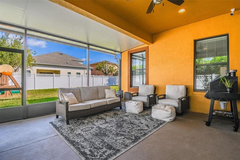 The covered and screened lanai has room for your outdoor sitting area, a grill and even a table. Room to hang a TV on the wall too!