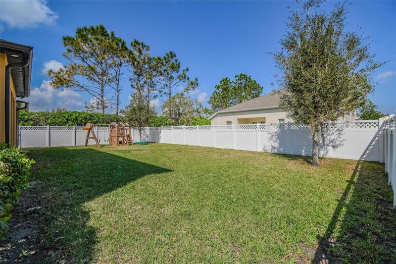 Large yard has room for a playset plus room to play.