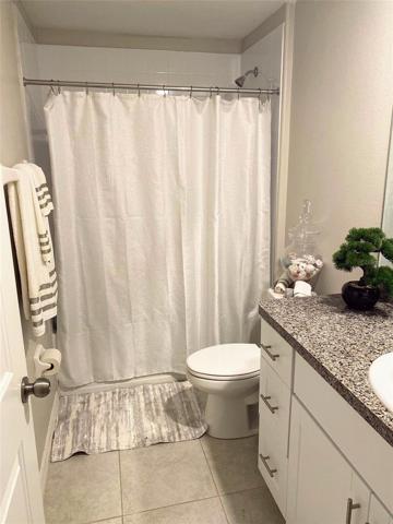 Guest Bathroom has tub and shower.
